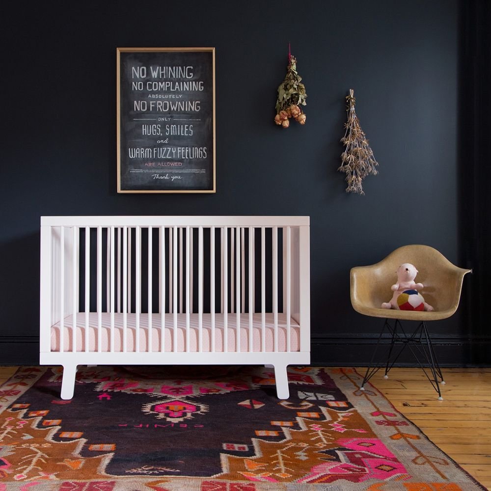 eames plastic side chair in nursery.