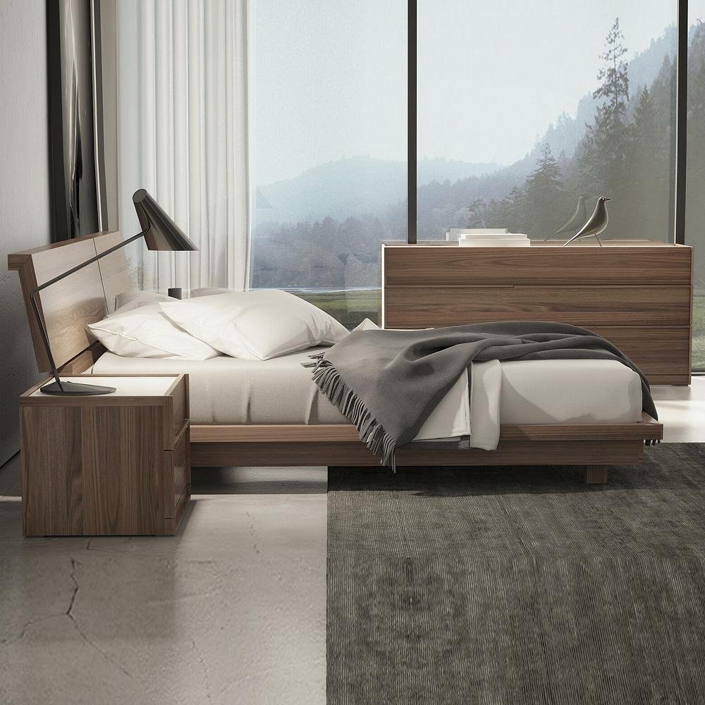 modern low bed with matching nightstand and dresser.