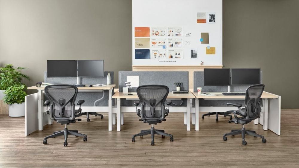 modern workspace with three ergonomic aeron chairs.